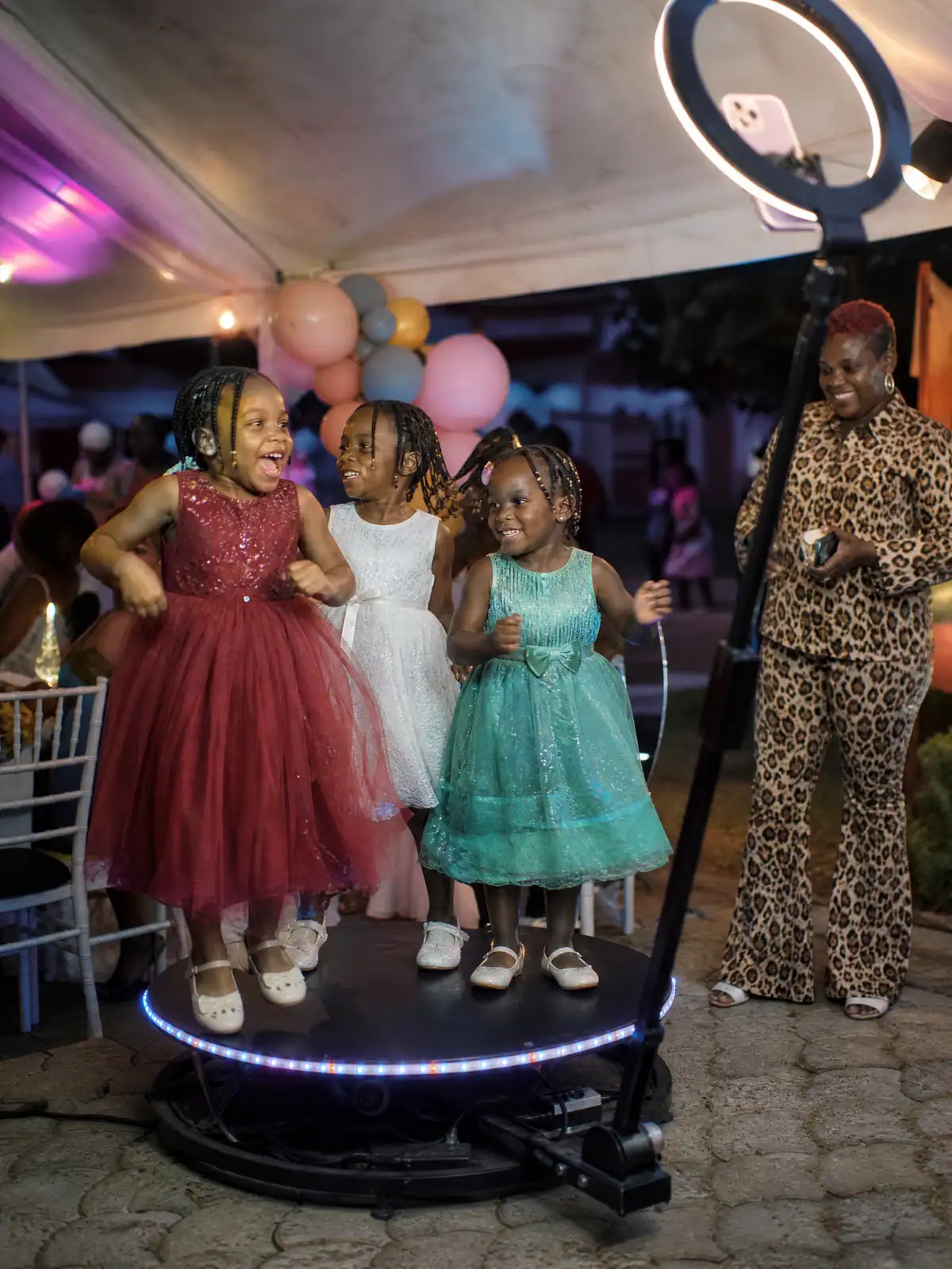 Children laughing on the 360 platform at a kids' birthday party in Freetown