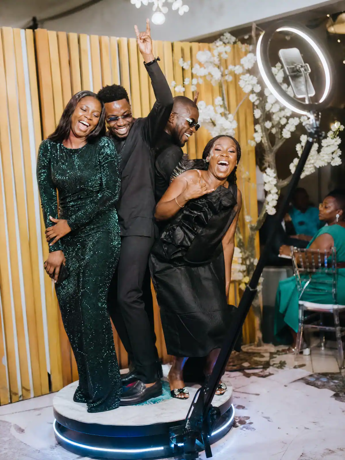 Colleagues laughing on the 360 booth at an end-of-year staff party in Freetown