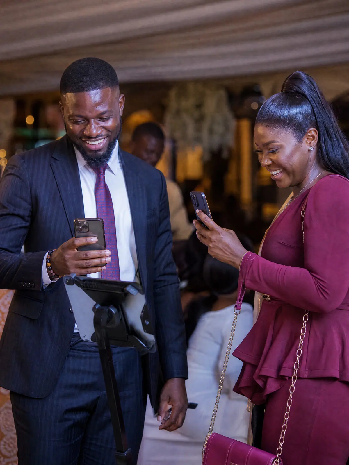 Guests scanning a QR code to download their branded 360 video at a corporate reception